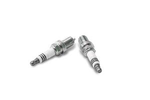 Car Iridium spark plugs in white background for texture copy space of Technician and service concept photo