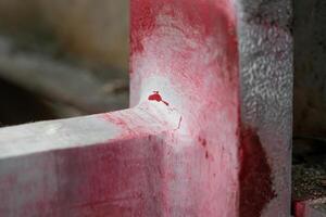 Cracks welding lines on steel part and use color white and red in Penetrant Testing process for check strength photo