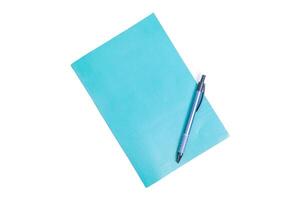 Green pastel color of Notebook and blue pen on the white background photo