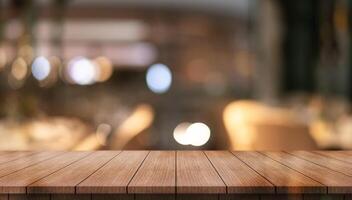 Empty wooden table top with lights bokeh on blur restaurant background photo