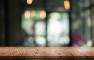 Empty wooden table top with lights bokeh on blur restaurant background. photo