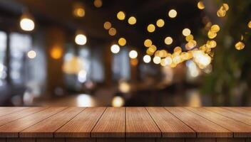 Empty wooden table top with lights bokeh on blur restaurant background photo