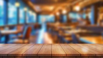 Empty wooden table top with lights bokeh on blur restaurant background photo