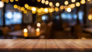 Empty wooden table top with lights bokeh on blur restaurant background photo