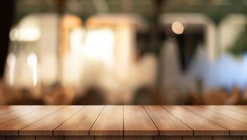 Empty wooden table top with lights bokeh on blur restaurant background photo