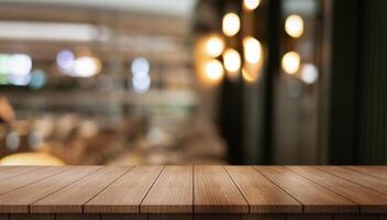 Empty wooden table top with lights bokeh on blur restaurant background photo