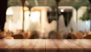 Empty wooden table top with lights bokeh on blur restaurant background photo