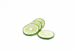 Bergamot Kaffir lime slices with on white background photo