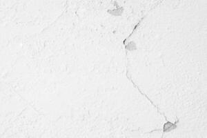 Crack cement wall and old paint white color for background and texture photo