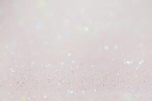 Mixed background, the main part is defocused and the thin focal part. Beige glitter background. photo