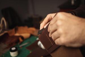 Tanner works with leather, small business, production. photo