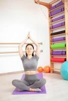 girl performs exercises for yoga in gym, gymnastics photo