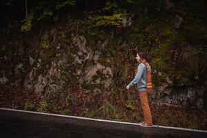 lonely man on road, concept of loneliness, depression, thoughtfulness. Autumn, mountains, beautiful background. Abstraction path to oneself, feeling of soul, climbing up photo