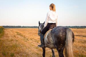 woman loves a horse. Love and friendship for the animal, care photo