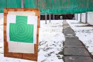 Paper target in the dash, hanging. Winter, firearms, gunfire photo