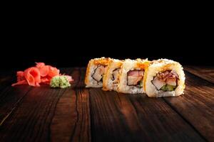 Japan sushi rolls isolated on black background photo