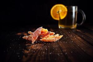 Orange peels in sugar. Candied fruit from orange photo