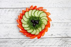 Beautiful sliced vegetables for the festive table photo