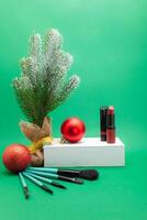 Christmas, New Year's background for make-up artist. brushes, Christmas decorations, spruce. Empty space for text. photo