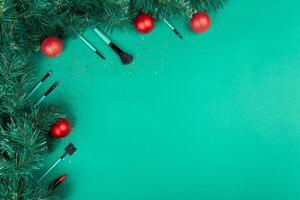 Christmas, New Year's background for make-up artist. brushes, Christmas decorations, spruce. Empty space for text. photo