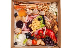 Healthy food delivery. Take away of natural organic low carb. Eat right concept, fitness nutrition take away in boxes, cutlery and package, top view, flat lay Food delivery for the holiday photo
