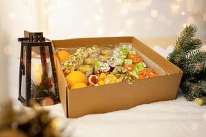Christmas, New Year, food delivery in boxes. Salads, caviar, bruschettas at home in quarantine photo