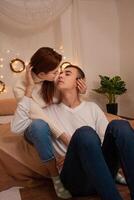 A young couple in love in a photo studio. Christmas scenery, guy and girl love each other. Posing for models in the studio on New Year's Eve Teenagers