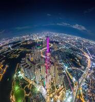 Aerial sunset view at Landmark 81 - it is a super tall skyscraper and Saigon bridge with development buildings along Saigon river, cityscape in the night photo