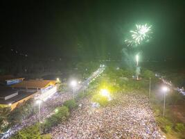 Celebration. Skyline with fireworks light up sky in Ba Den mountain, Tay Ninh city, Vietnam. Beautiful night view cityscape. Holidays, celebrating New Year and Tet holiday photo