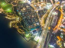 Aerial view of Ho Chi Minh City skyline and skyscrapers in center of heart business at Ho Chi Minh City downtown. Bridges and many buildings, local houses photo