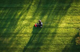 AI generated person's mowing lawn of grass photo