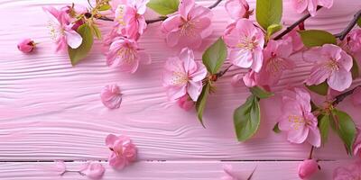 AI generated pink cherry blossoms with leaves on a pretty pink wood table photo