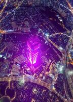 Aerial sunset view at Landmark 81 - it is a super tall skyscraper and Saigon bridge with development buildings along Saigon river, cityscape in the night photo