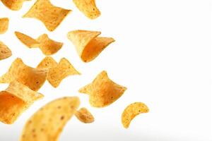 AI generated Corn chips of triangular shape levitate on a white background Generative AI photo