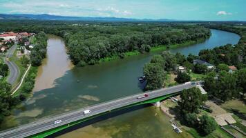 Aerial backwards view of Bodrog and Tisza rivers confluence and Tokaj bridge in Hungary video