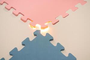 Concept for teamwork, problem solving or mystery stuff. Jigsaw puzzle with a glowing light. After some edits. photo