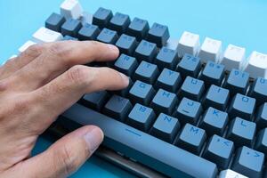 Mechanical keyboard isolated on blue background. After some edits. photo