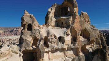 Aerial drone view of the famous Rock Sites of Cappadocia, Turkey. This old settlement is located in the rose red valley in Goreme. video