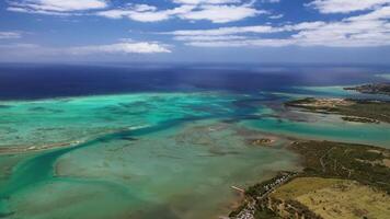 The view from the bird's eye view of the fishing village and the mountains. Indian ocean. Mauritius video