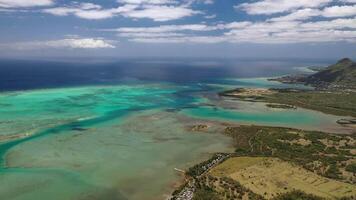 The view from the bird's eye view of the fishing village and the mountains. Indian ocean. Mauritius video