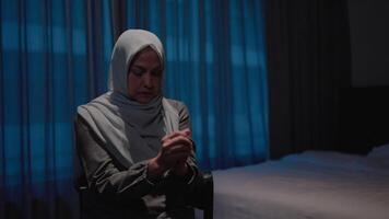 Muslim woman praying for Allah with her feelings of devotion and commitment on her face video