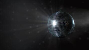 Disco Ball with Reflected Moving Rays Rotating. Mirror disco ball in white light. Isolated disco ball on black background. Close-up. Mirror ball spinning indoors. Performance. The reflection of lights video