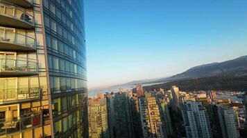 Vancouver, Canada - September 16, 2023. Flight by FPV drone between skyscrapers video