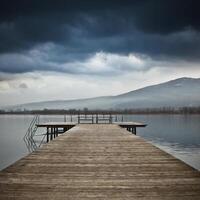 Old wooden jetty at a lake photo