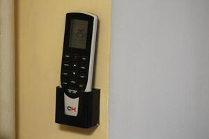 KYIV, UKRAINE - January 13, 2024 Remote controls on the wall photo