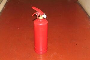 Manual powder fire extinguisher for extinguishing indoor fires photo