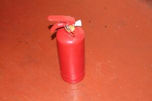 Manual powder fire extinguisher for extinguishing indoor fires photo