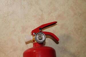 Manual powder fire extinguisher for extinguishing indoor fires photo