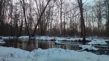 River surrounded by snow in the cold winter video