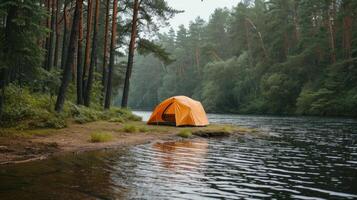 AI generated orange tourist tent stands on the river bank surrounded by a pine forest with copy cpace photo